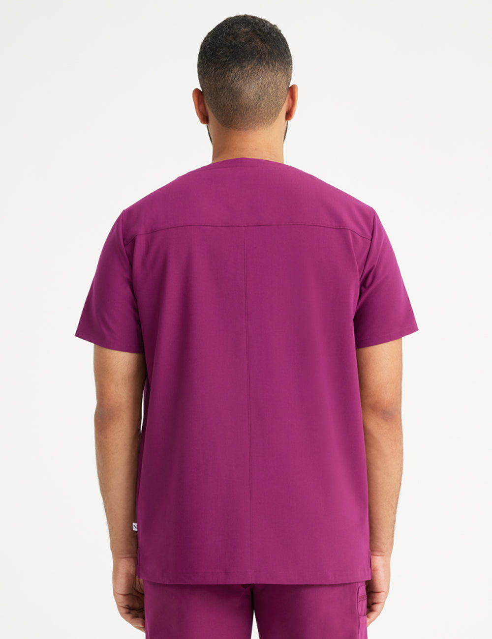 Stylish burgundy scrub top for men, combining a modern fit with a three-pocket design