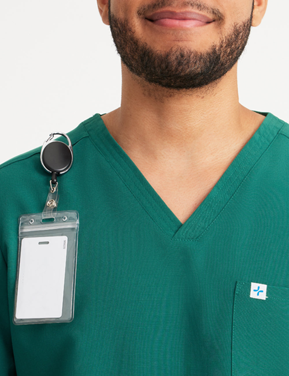 Hunter green men's V-neck scrub top with three pockets, designed for style and practicality