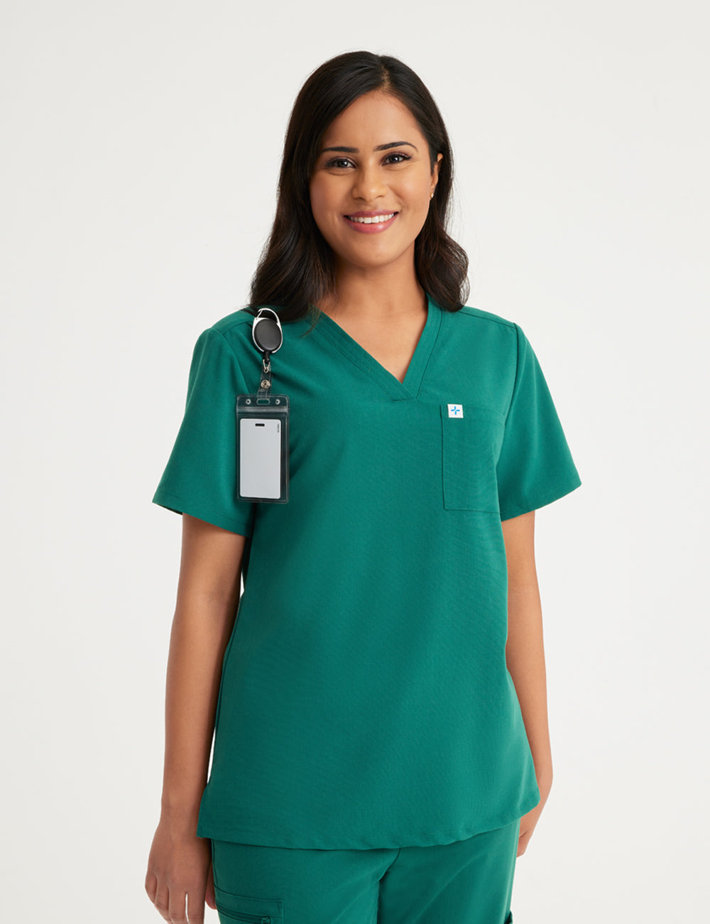Hunter green women's V-neck scrub top with two pockets, designed for functionality and style
