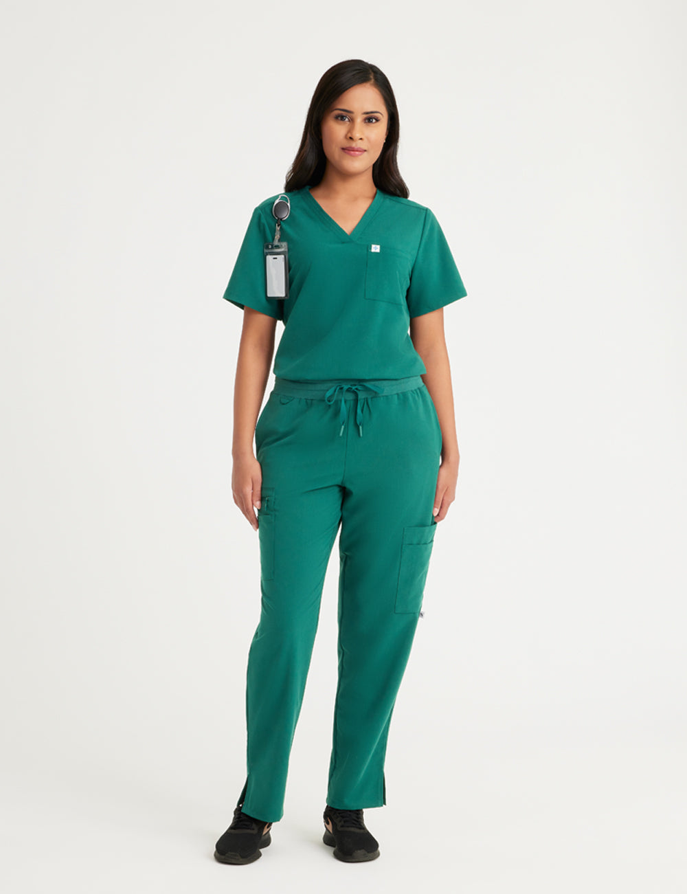 Hunter green women's V-neck scrub top with two pockets, designed for functionality and style