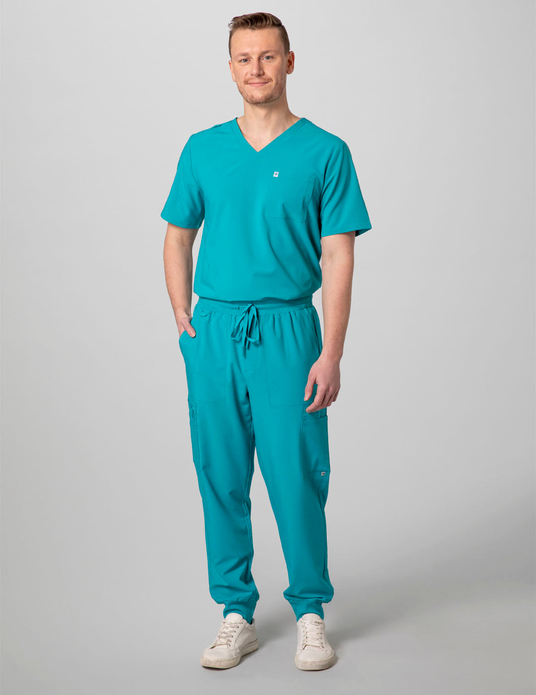 Teal men's V-neck scrub top with two pockets, combining style and practicality for professional wear