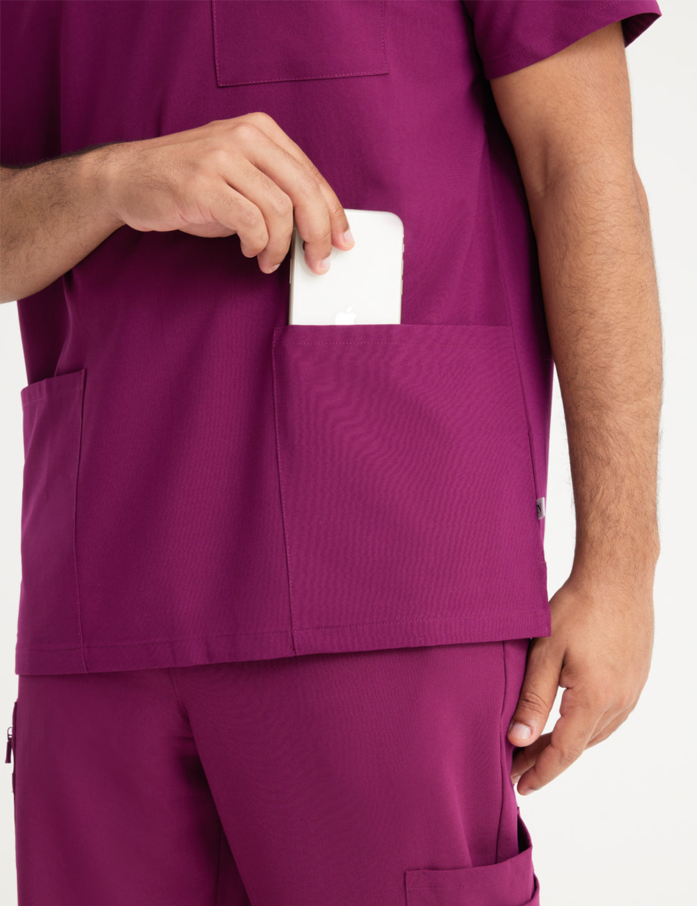 Durable burgundy V-neck scrub top for men, offering comfort and utility in professional settings