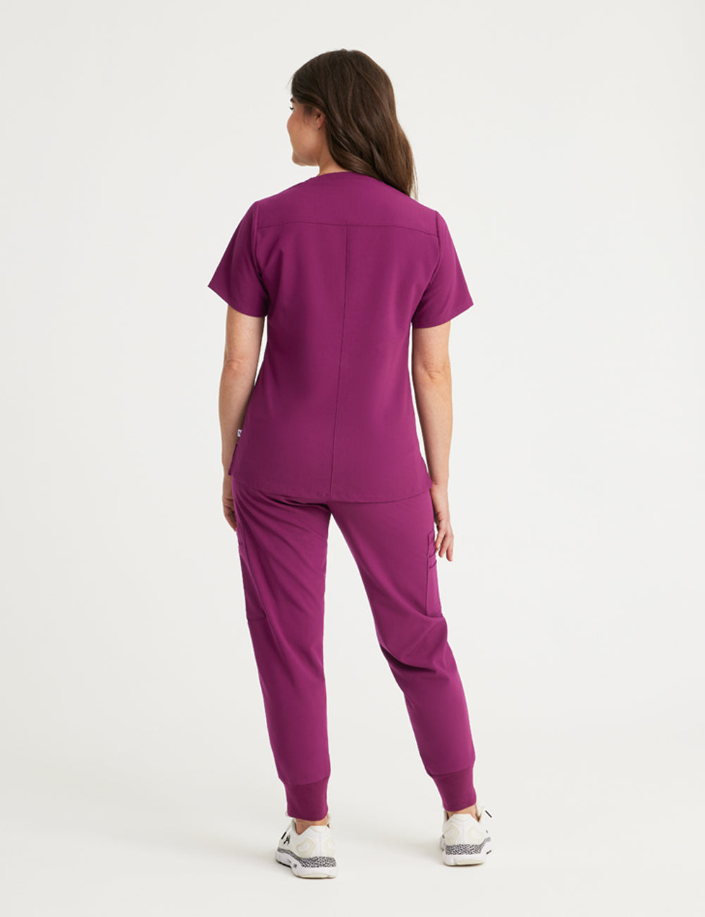 Durable burgundy V-neck scrub top for women, offering comfort and professional wear