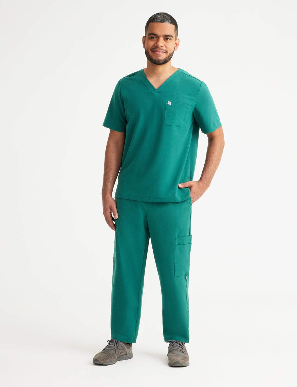 Hunter green men's scrub pants with seven pockets, designed for style and utility