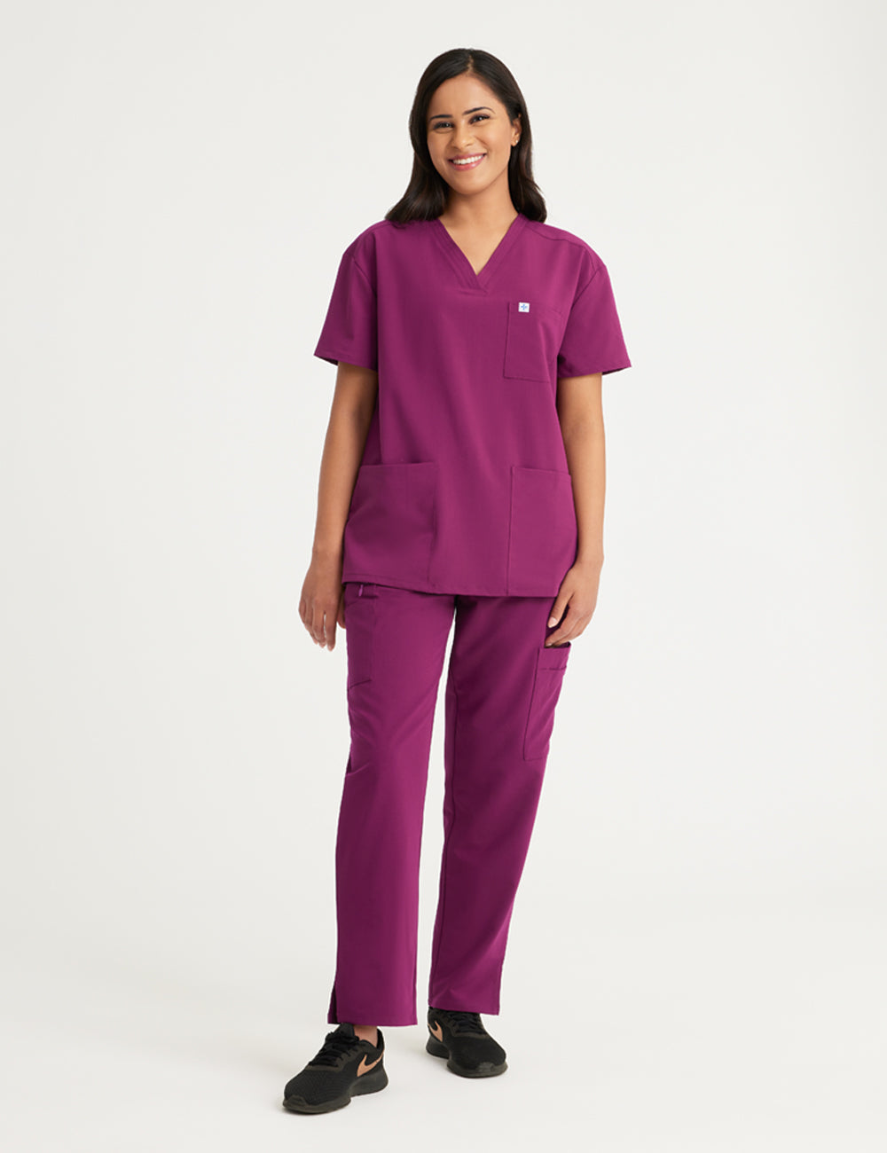 Burgundy women's V-neck scrub top with three pockets, designed for style and utility