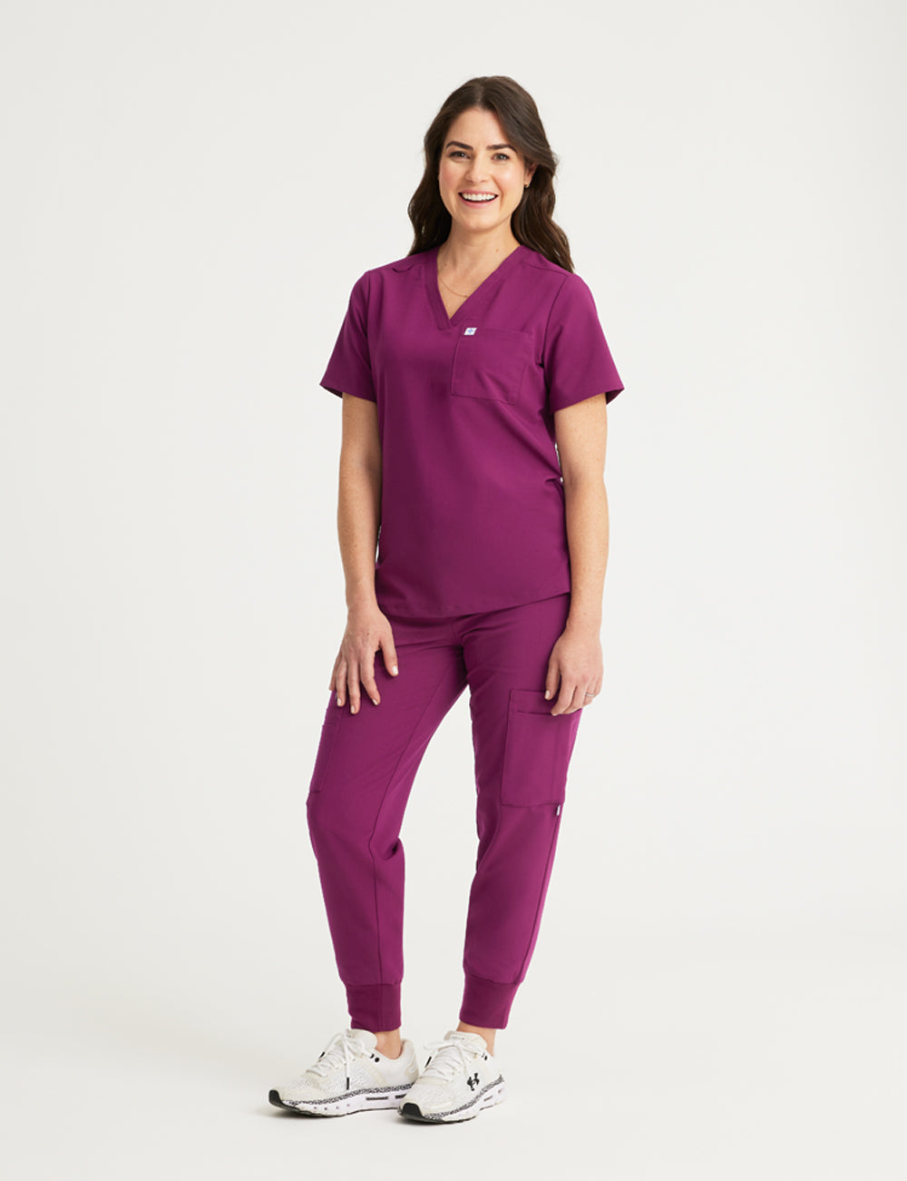 Burgundy women's V-neck scrub top with two pockets, designed for style and practicality