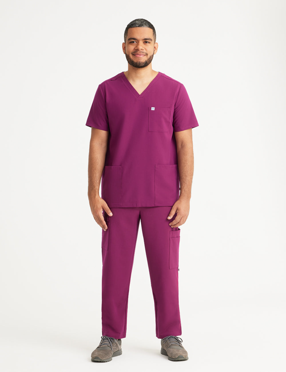 Burgundy men's scrub pants with seven pockets, offering a professional look and plenty of storage