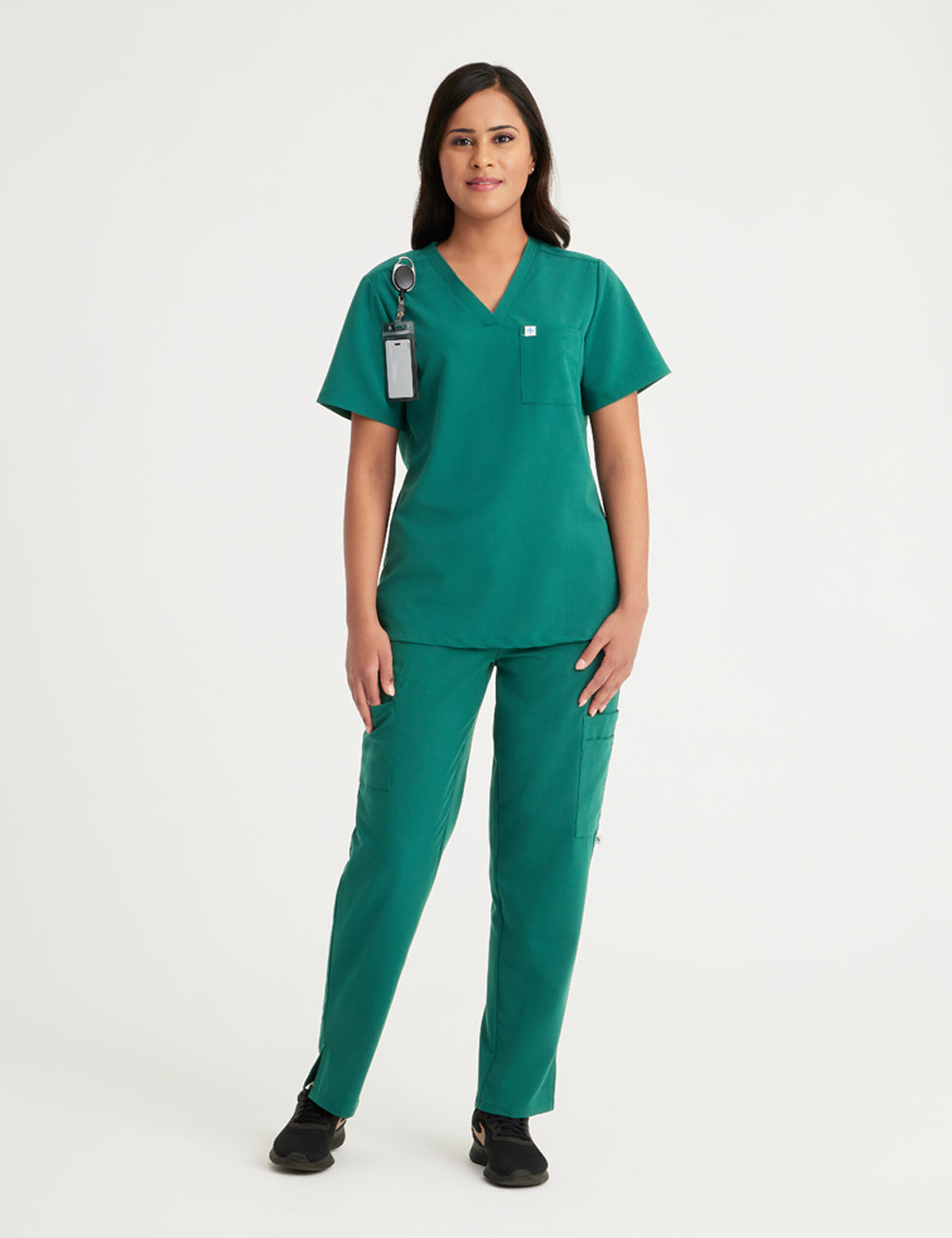 Stylish hunter green scrub top for women, crafted with a classic V-neck style and two functional pockets