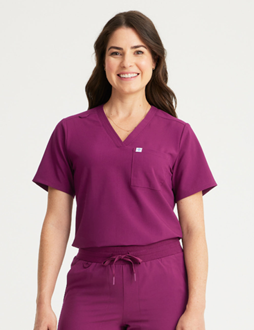 Burgundy women's V-neck scrub top with two pockets, designed for style and practicality