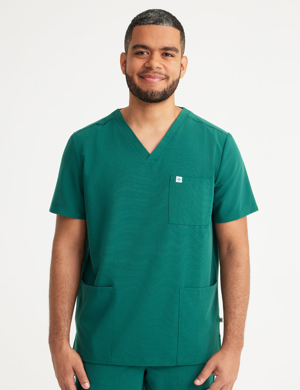 Hunter green men's V-neck scrub top with three pockets, designed for style and practicality