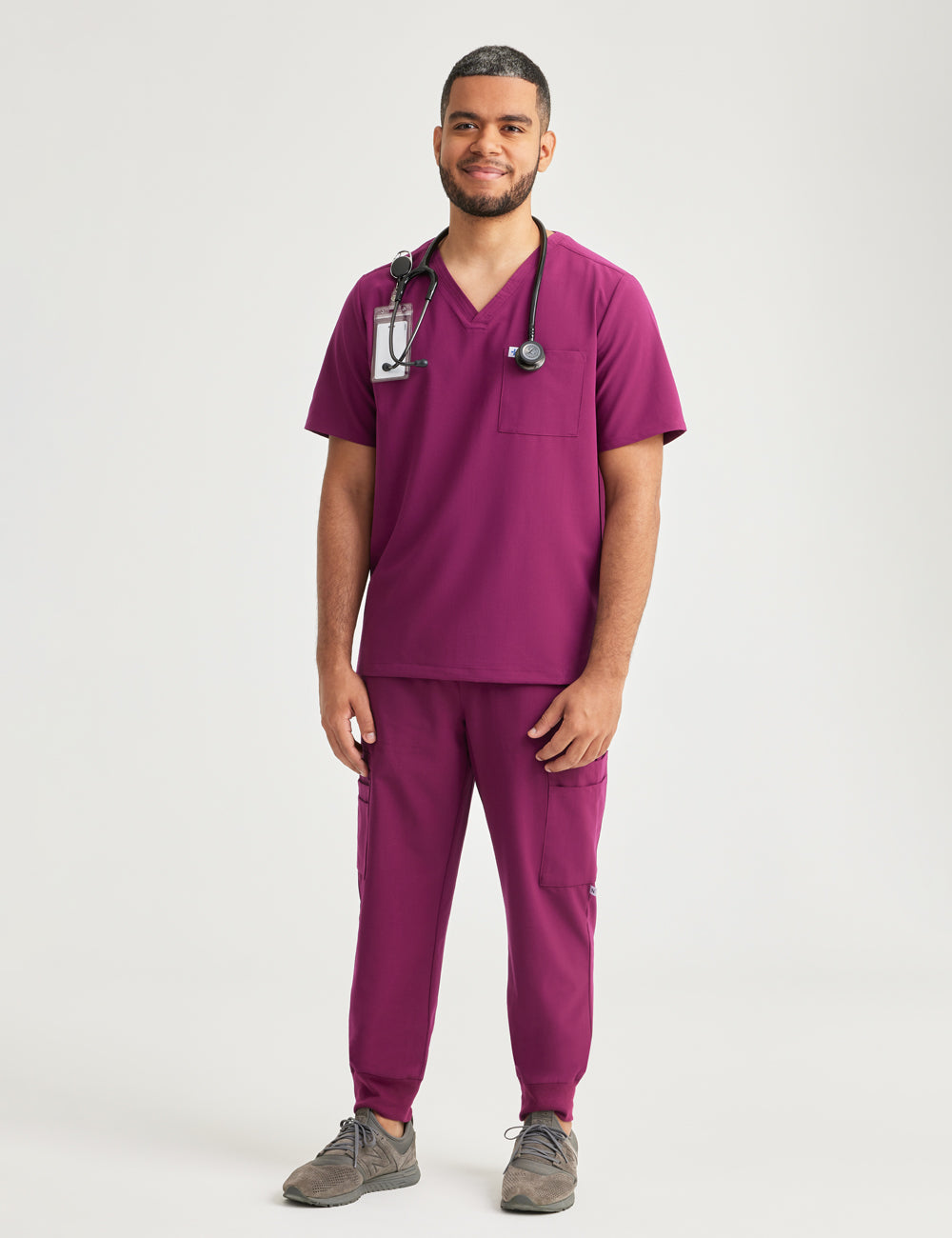 Stylish burgundy scrub top for men, offering a classic fit and two convenient pockets