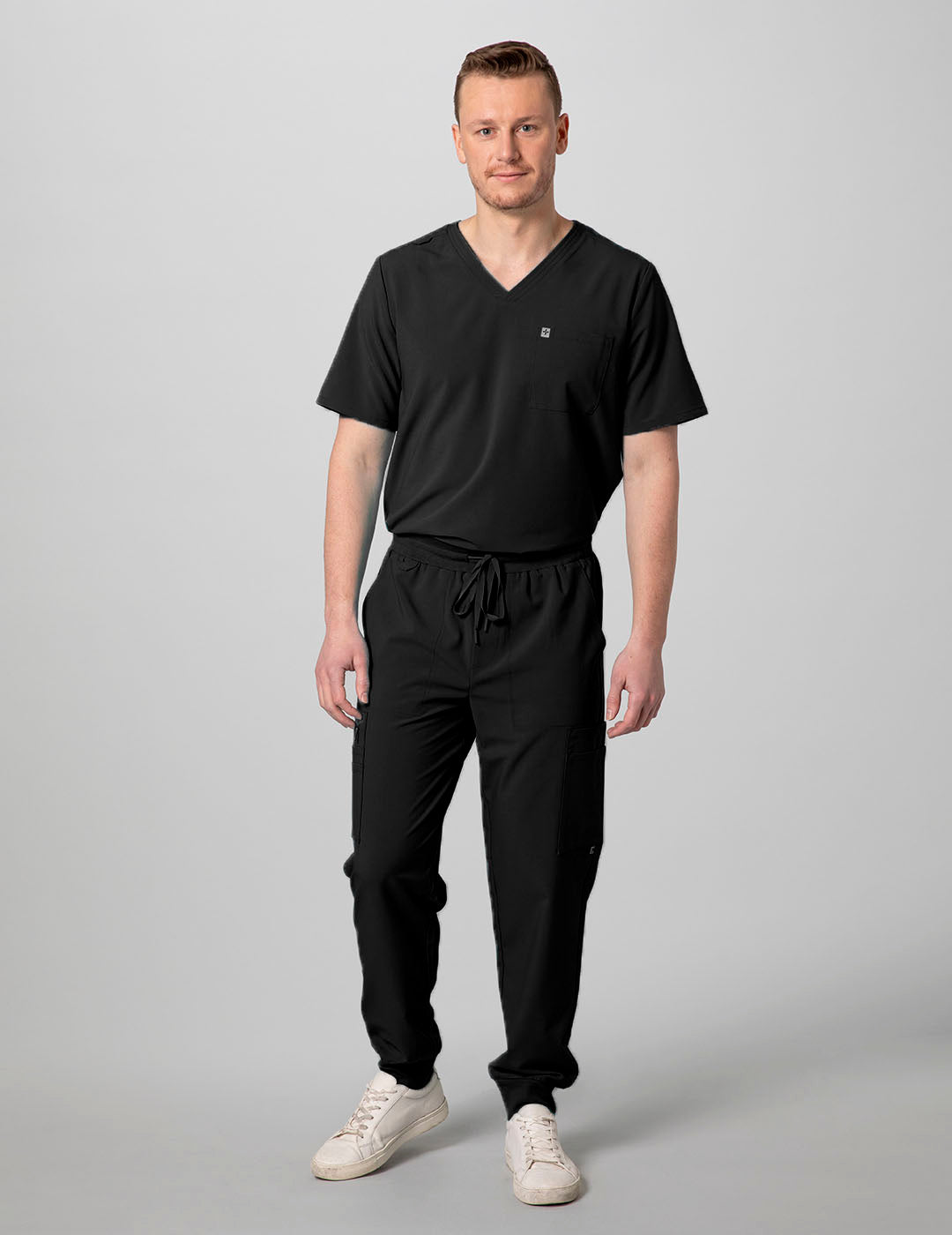 Durable and stylish men's 2-pocket scrub top in black, designed for comfort and utility during long shifts.