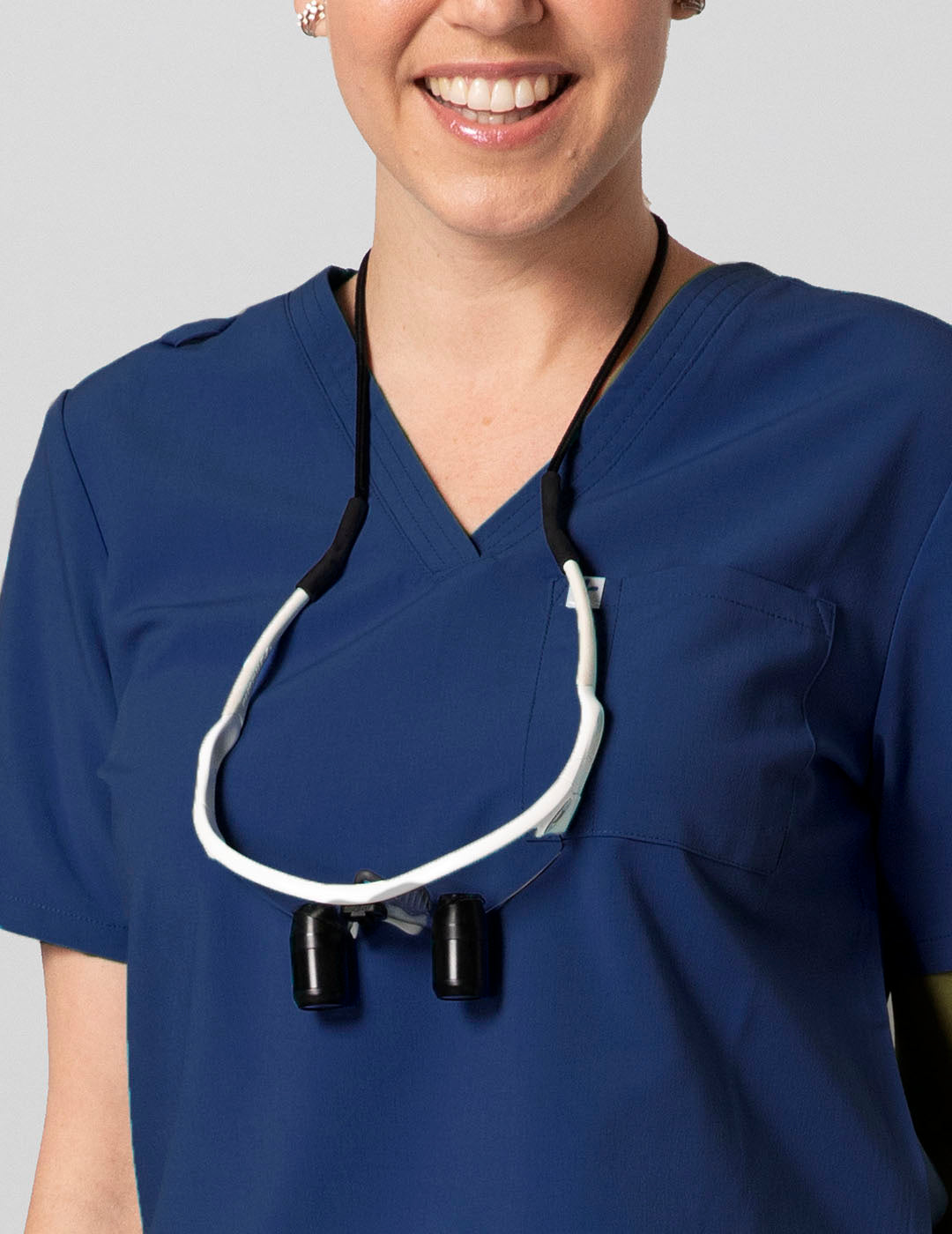 Comfortable and durable navy V-neck scrub top for women, crafted for professional use
