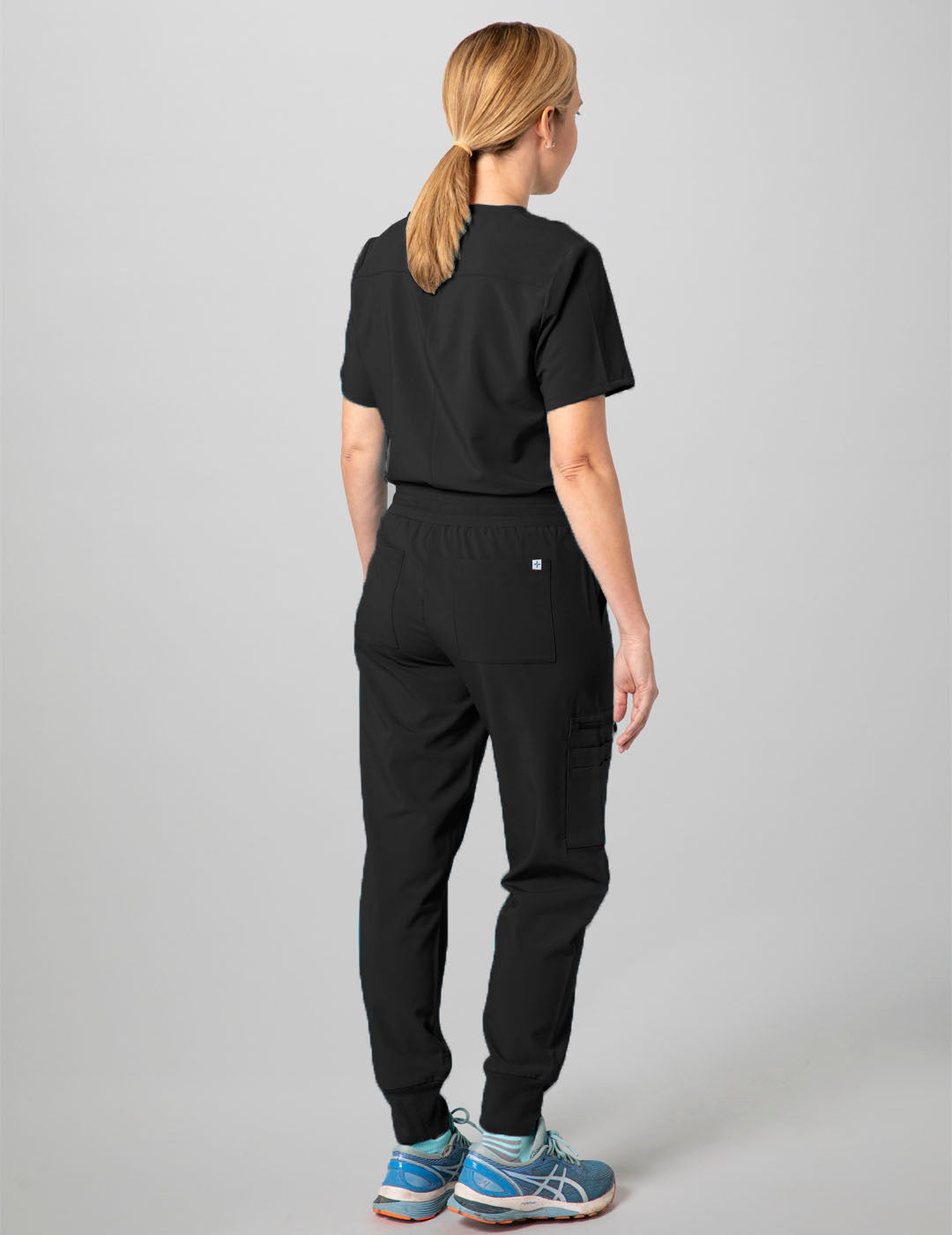 Durable black V-neck scrub top for women, crafted for comfort and professional use