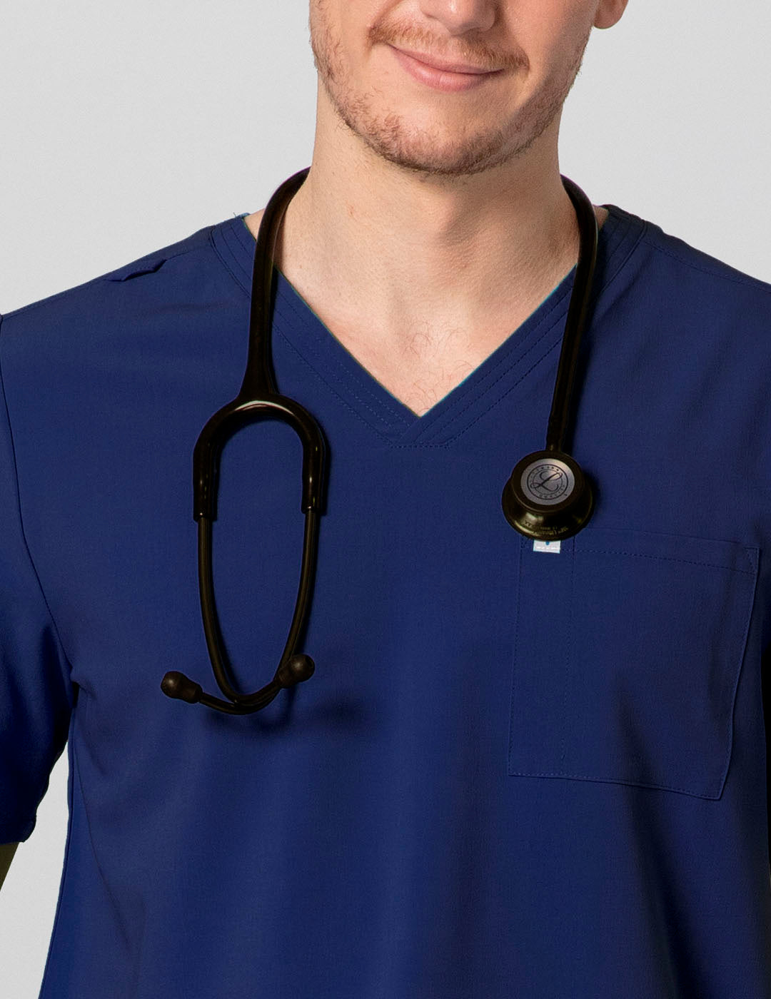 Navy men's V-neck scrub top with two pockets, offering a sleek and professional look