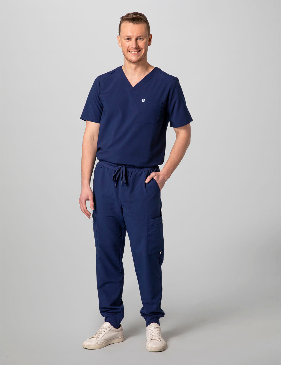 Durable navy V-neck scrub top for men, combining comfort with practical storage