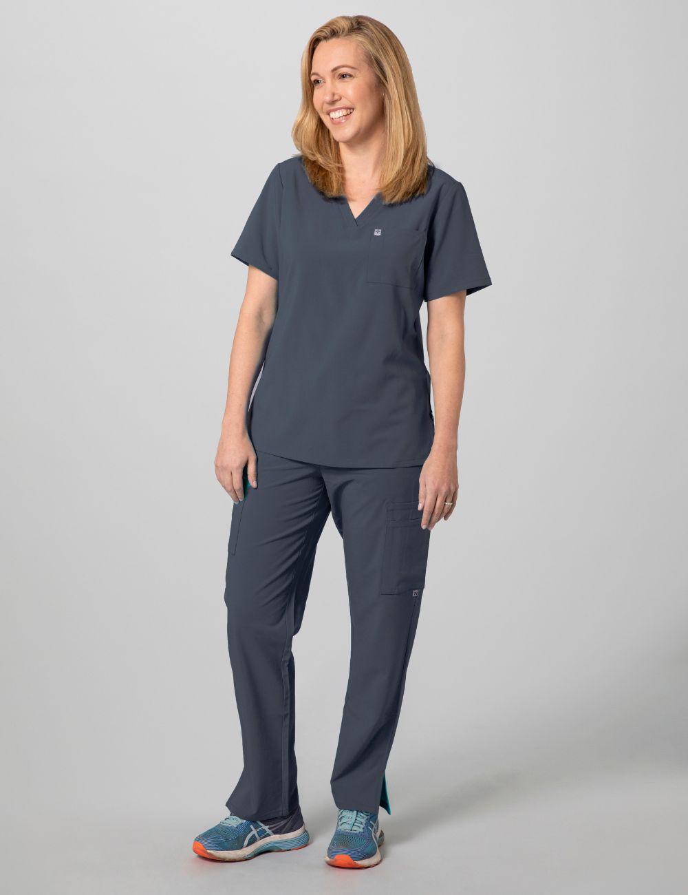 Pewter women's V-neck scrub top with two pockets, offering a sleek and functional design
