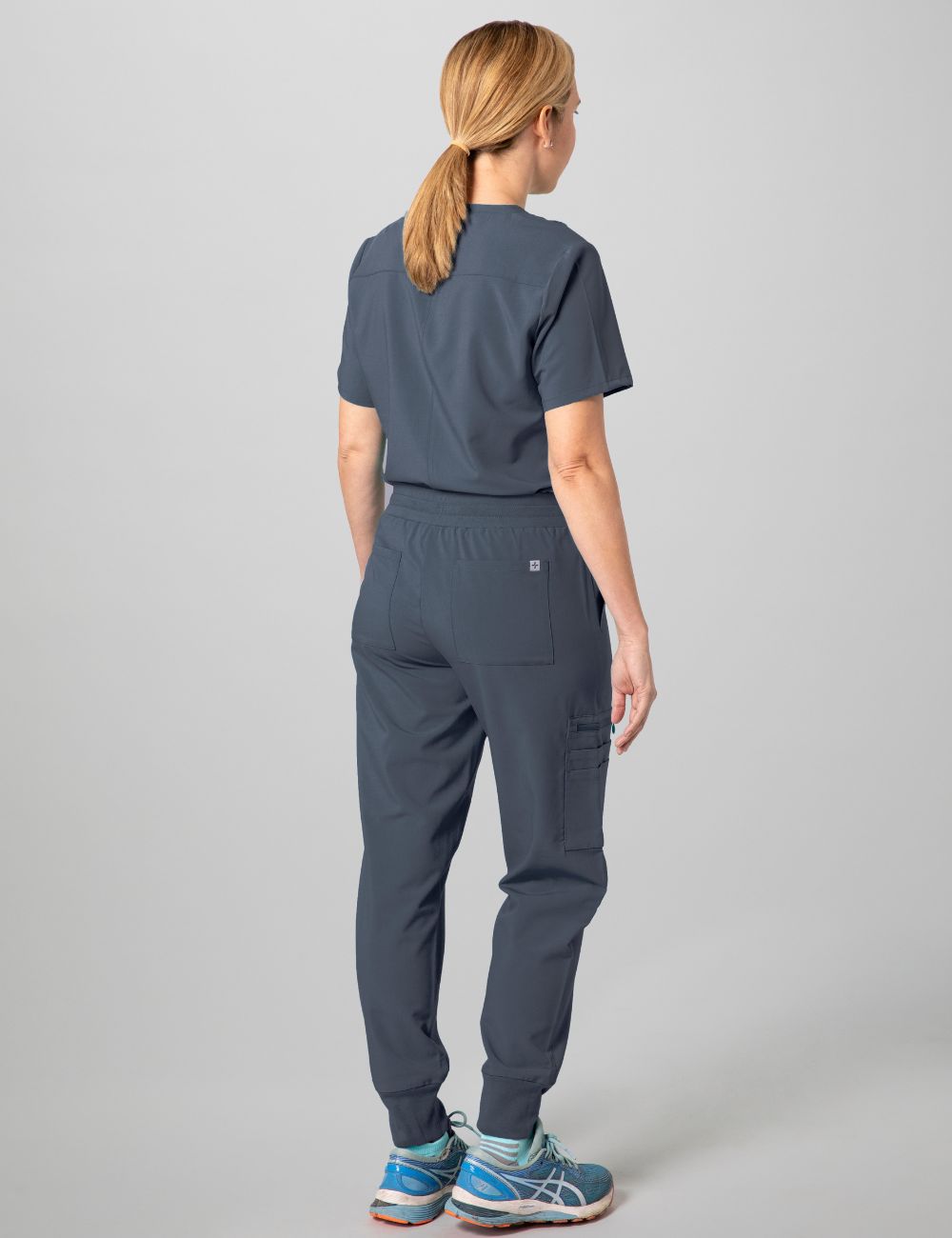 Durable and comfortable pewter V-neck scrub top for women, ideal for professional use