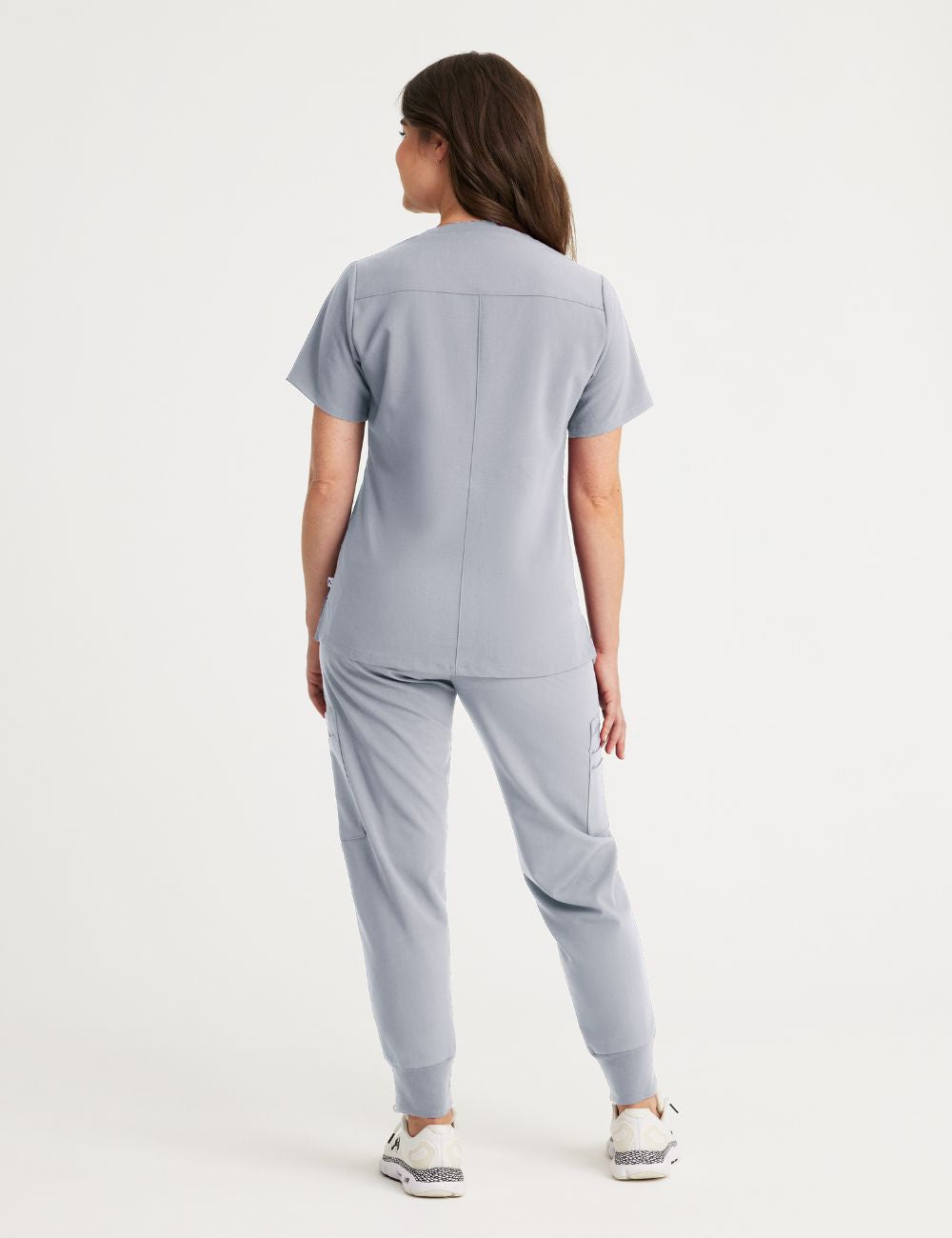 Comfortable and durable stone gray V-neck scrub top for women, crafted for professional wear