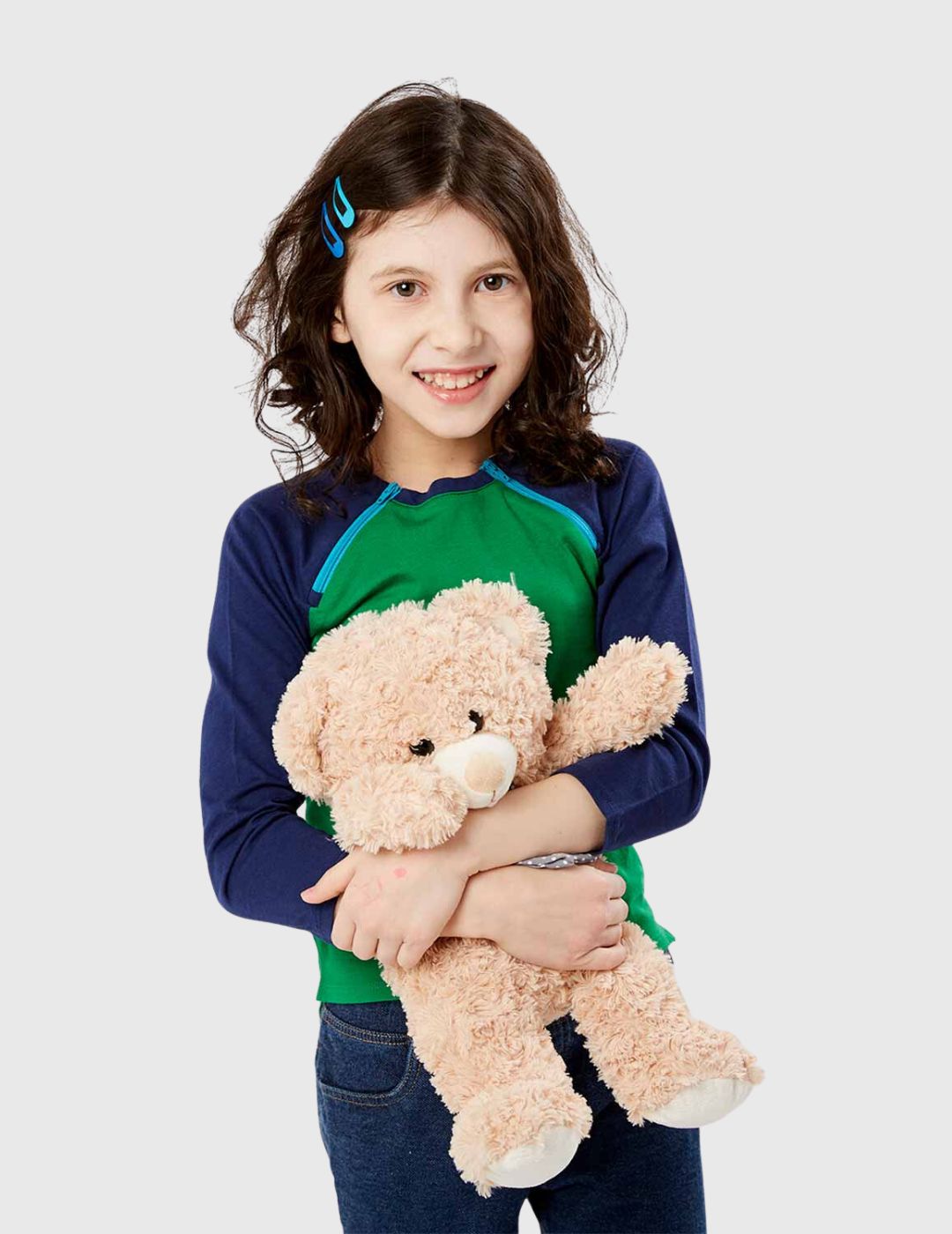Playful Jungle/Navy Kids Chest Port Access Shirt by Care+Wear, featuring child-friendly patterns and easy chest port access for pediatric care. Model is wearing size Small