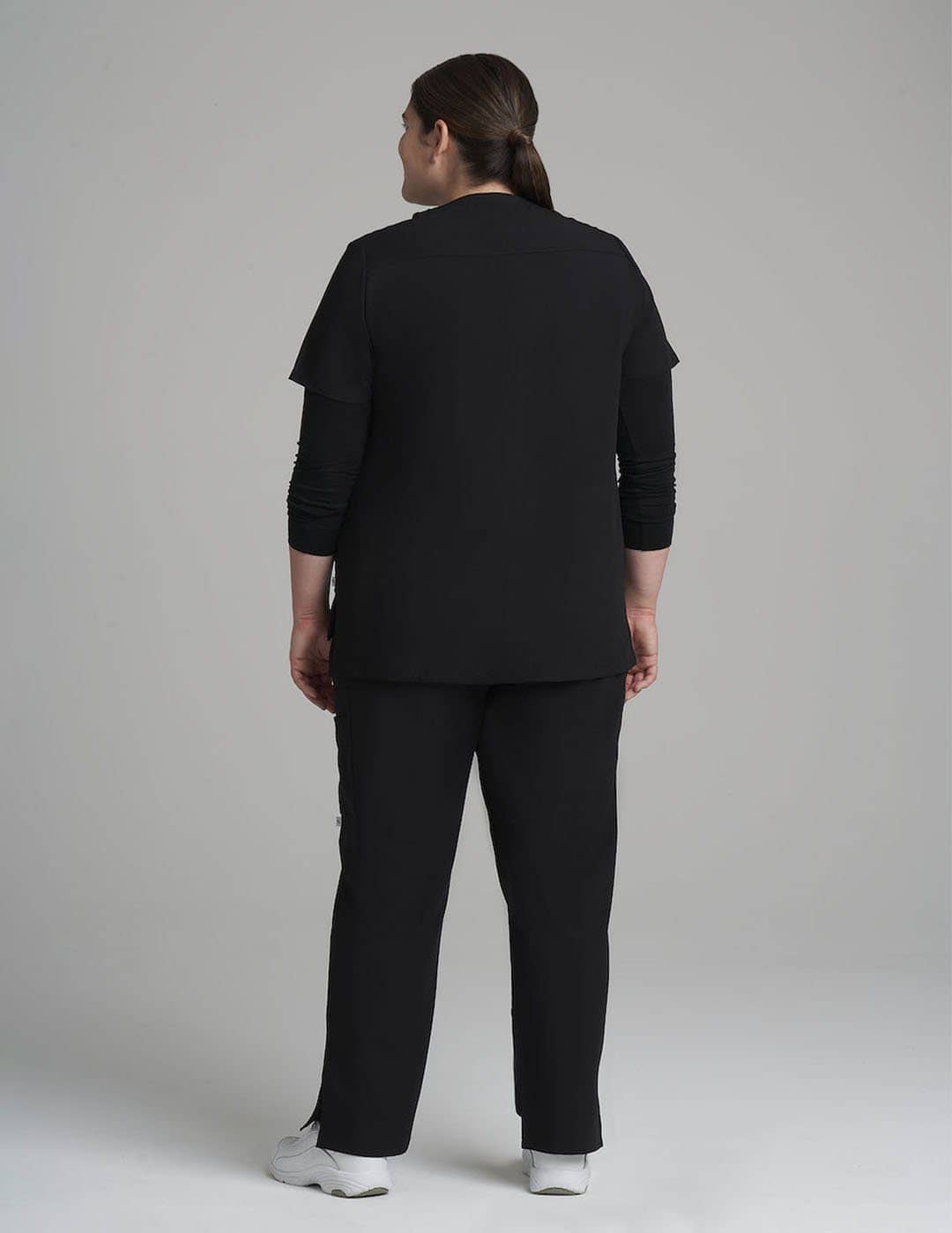 Women's 6-pocket V-neck scrub top in navy, offering a sleek and professional design with ample storage.