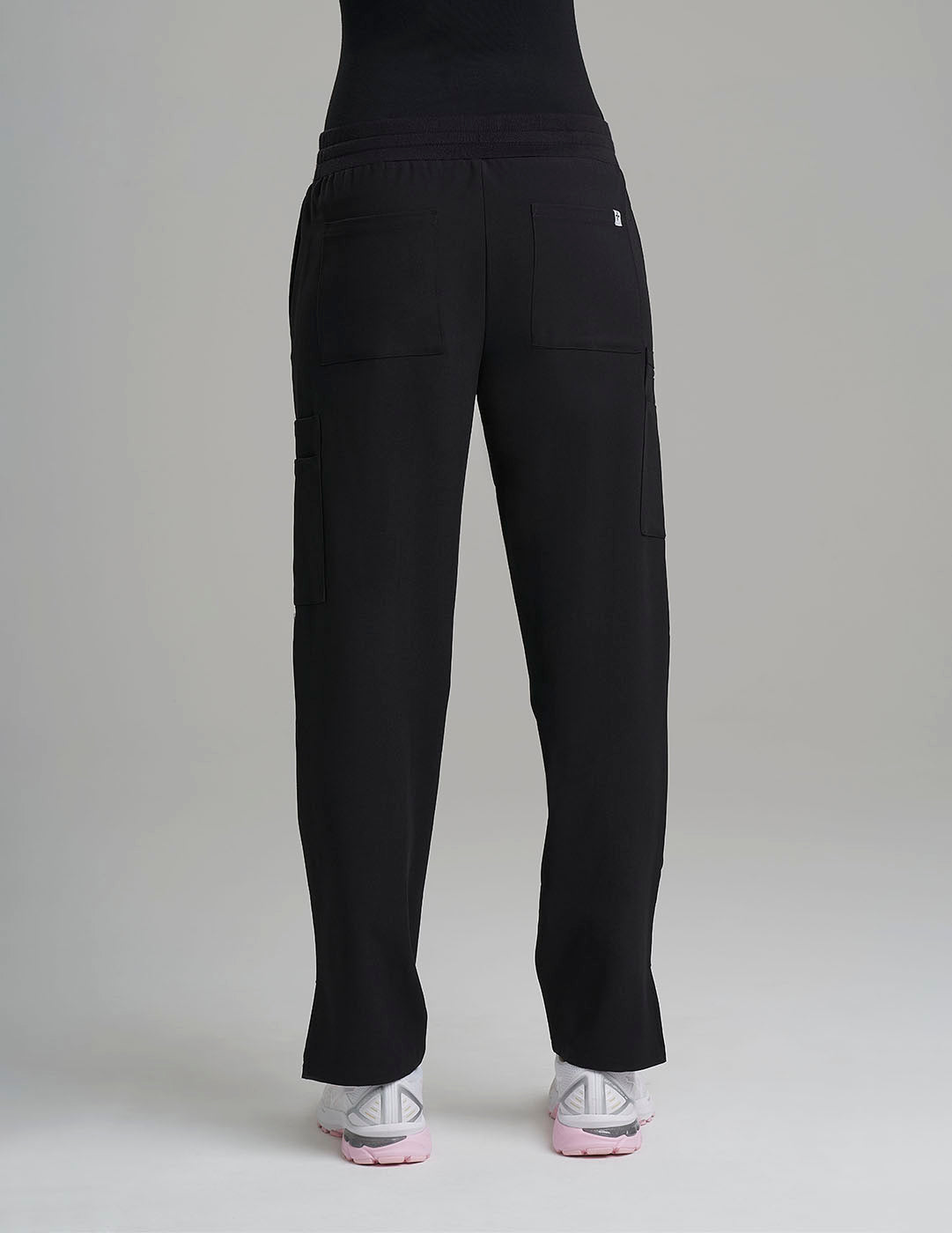 Durable black scrub pants for women, offering comfort and a nine-pocket layout for utility