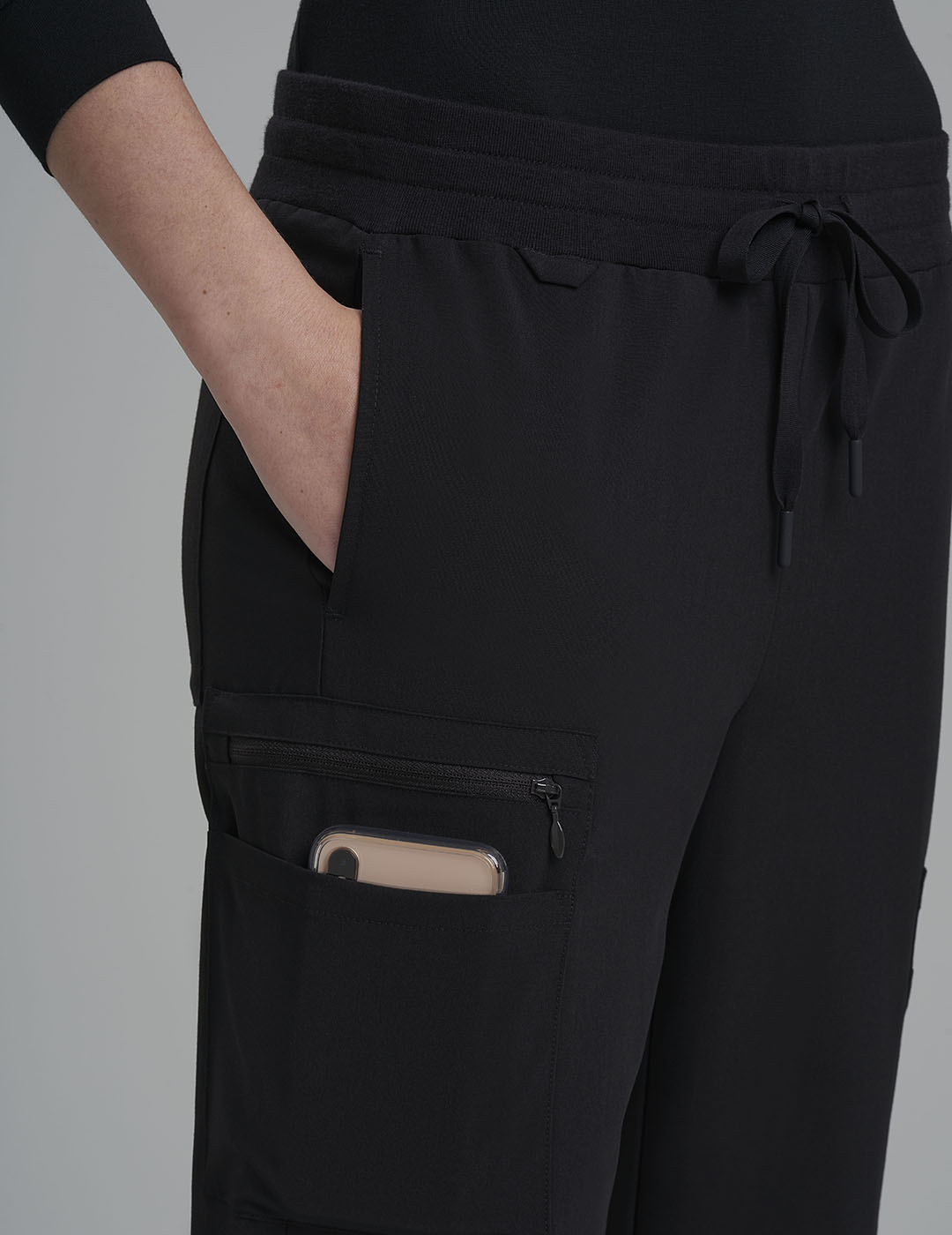 Black women's straight-leg scrub pants with nine pockets, combining functionality and a sleek look