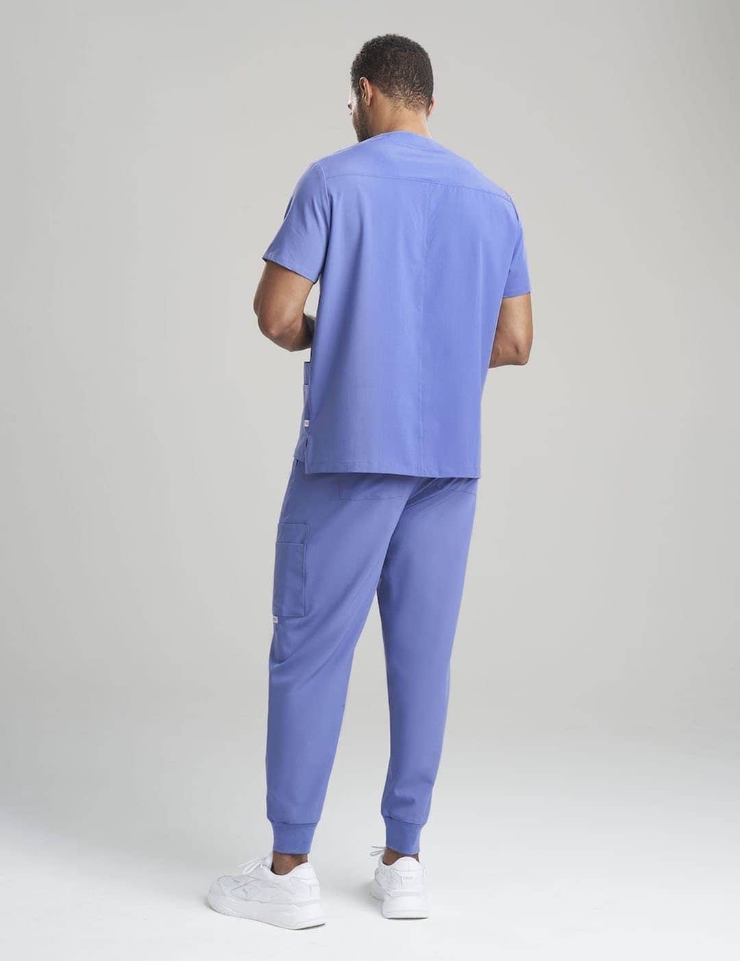 Durable ceil blue V-neck scrub top for men, crafted with comfort and practicality in mind