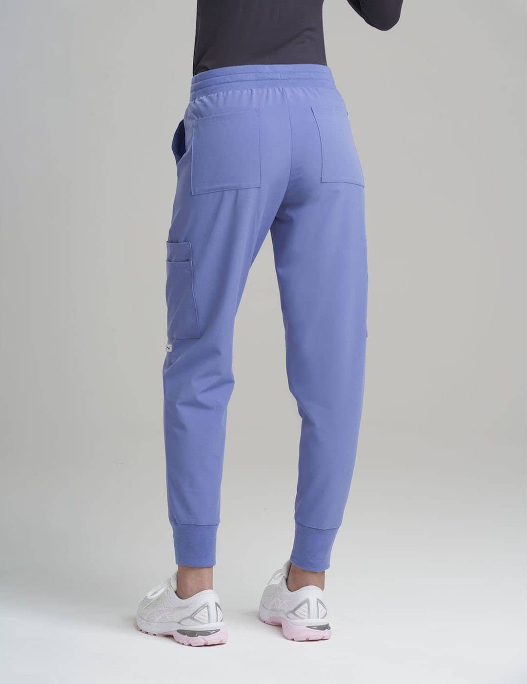 Functional ceil blue jogger scrub pants for women, featuring a modern design and ample storage