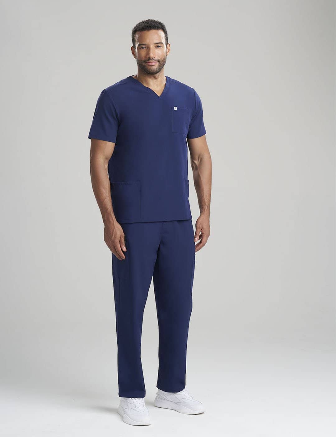 Durable navy scrub pants for men, featuring seven pockets and a straight-leg design
