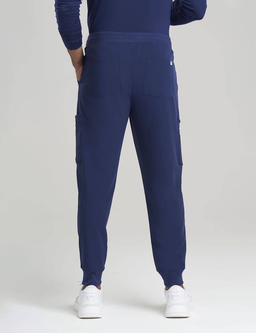 Men&#39;s 10-pocket jogger scrub pants in navy, offering style, comfort, and ample storage