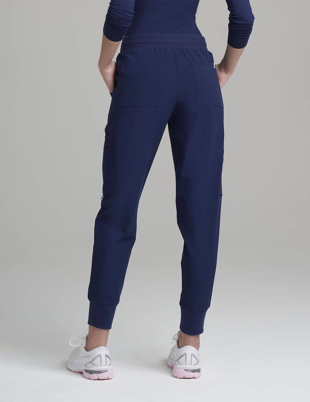 Women&#39;s navy jogger scrub pants, featuring a functional 12-pocket design for professional use
