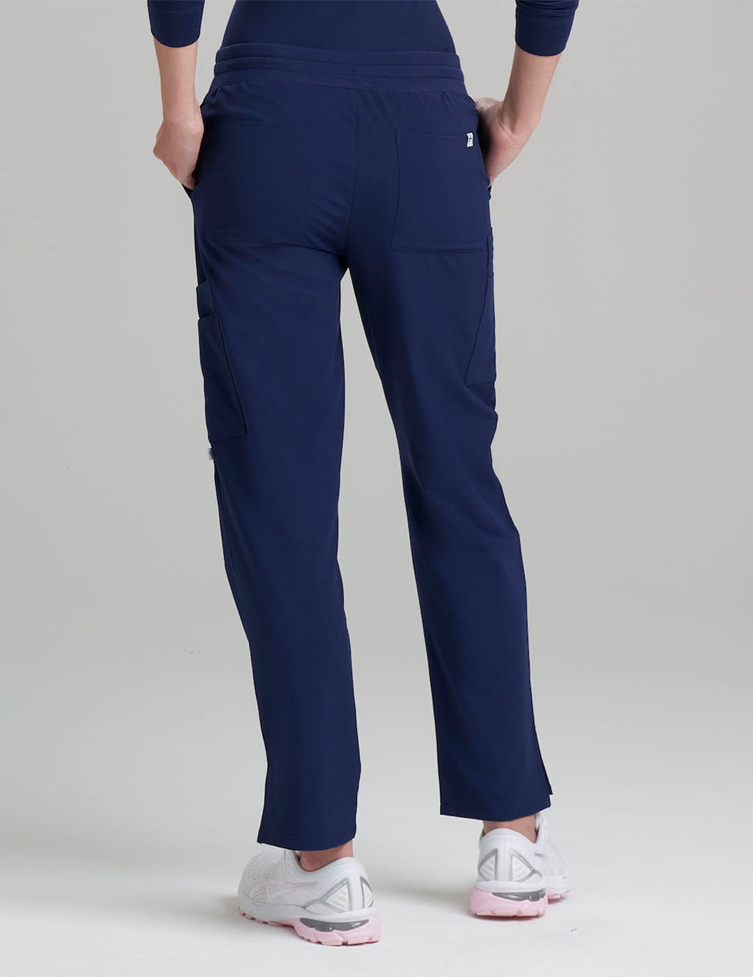 Navy women's straight-leg scrub pants with nine pockets, combining functionality and classic style