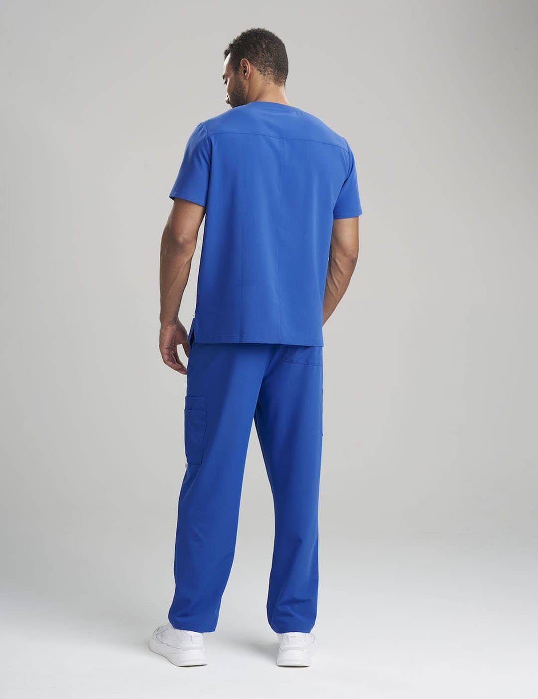 Durable royal blue V-neck scrub top for men, crafted for comfort and utility