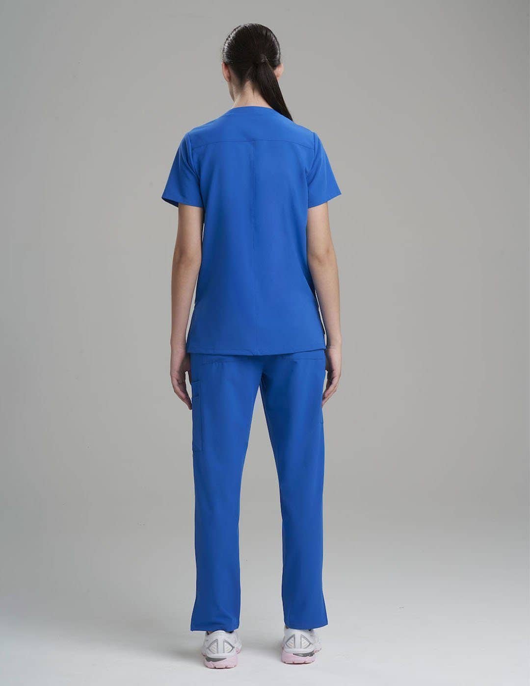 Women's 6-pocket V-neck scrub top in royal blue, offering bold style and ample storage.