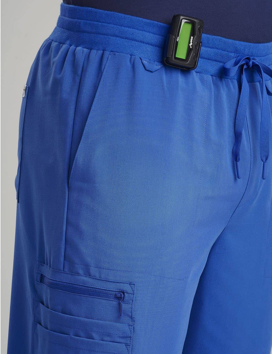 Care+Wear Men's 10-Pocket Jogger Scrub Pants in Royal Blue, offering vibrant style and plenty of storage for healthcare professionals. Model is wearing size Large
