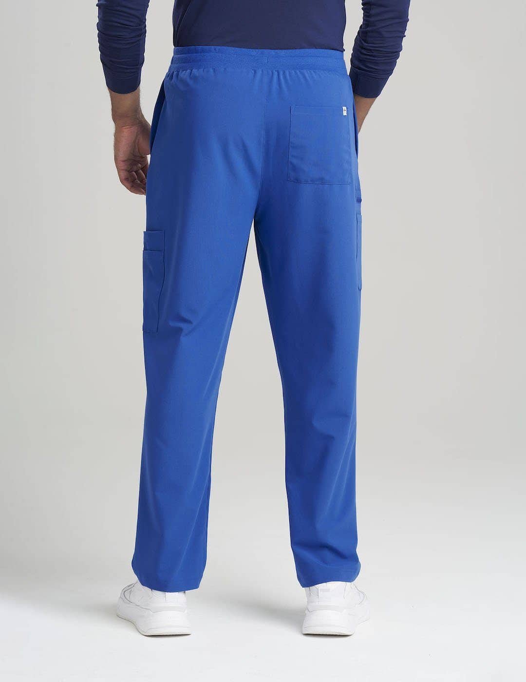 Durable and stylish royal blue scrub pants for men, crafted with seven pockets for ample storage