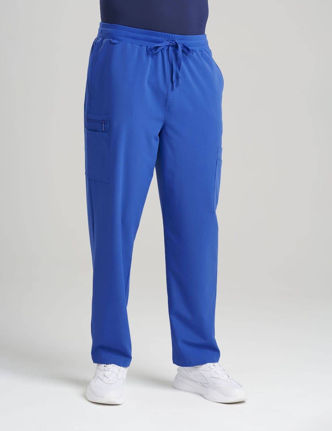 Royal Blue Men's 7-Pocket Straight Leg Scrub Pants from Care+Wear, featuring bold color and functional storage for medical gear. Model is wearing size Large