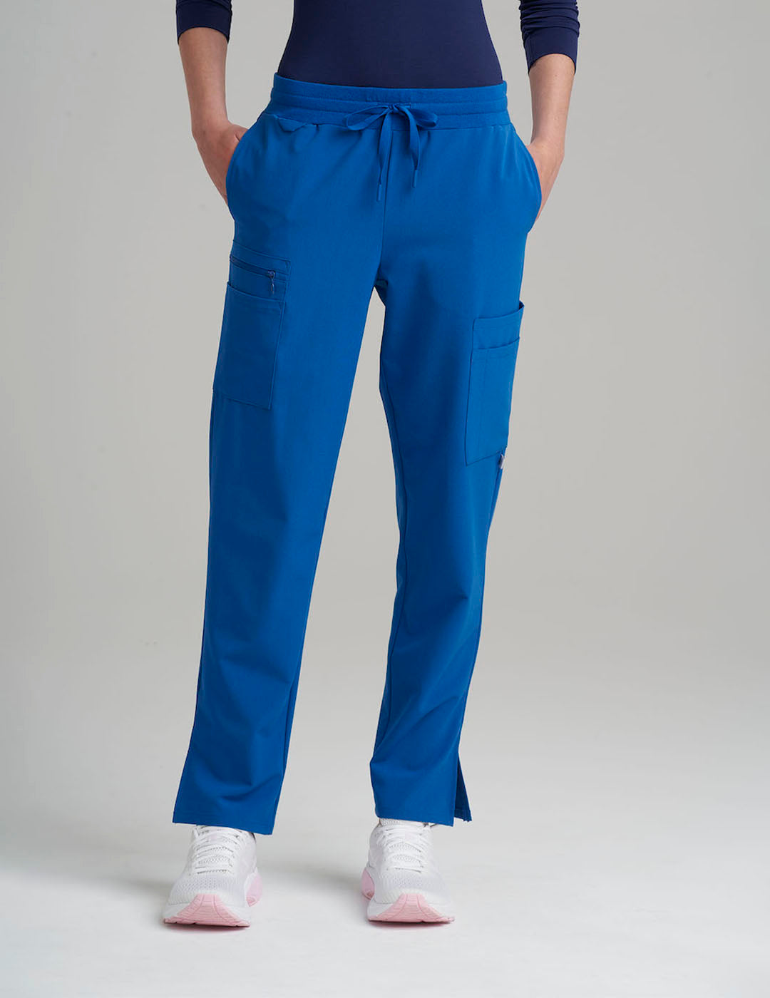 Royal blue women's straight-leg scrub pants with nine pockets, offering a vibrant and practical design