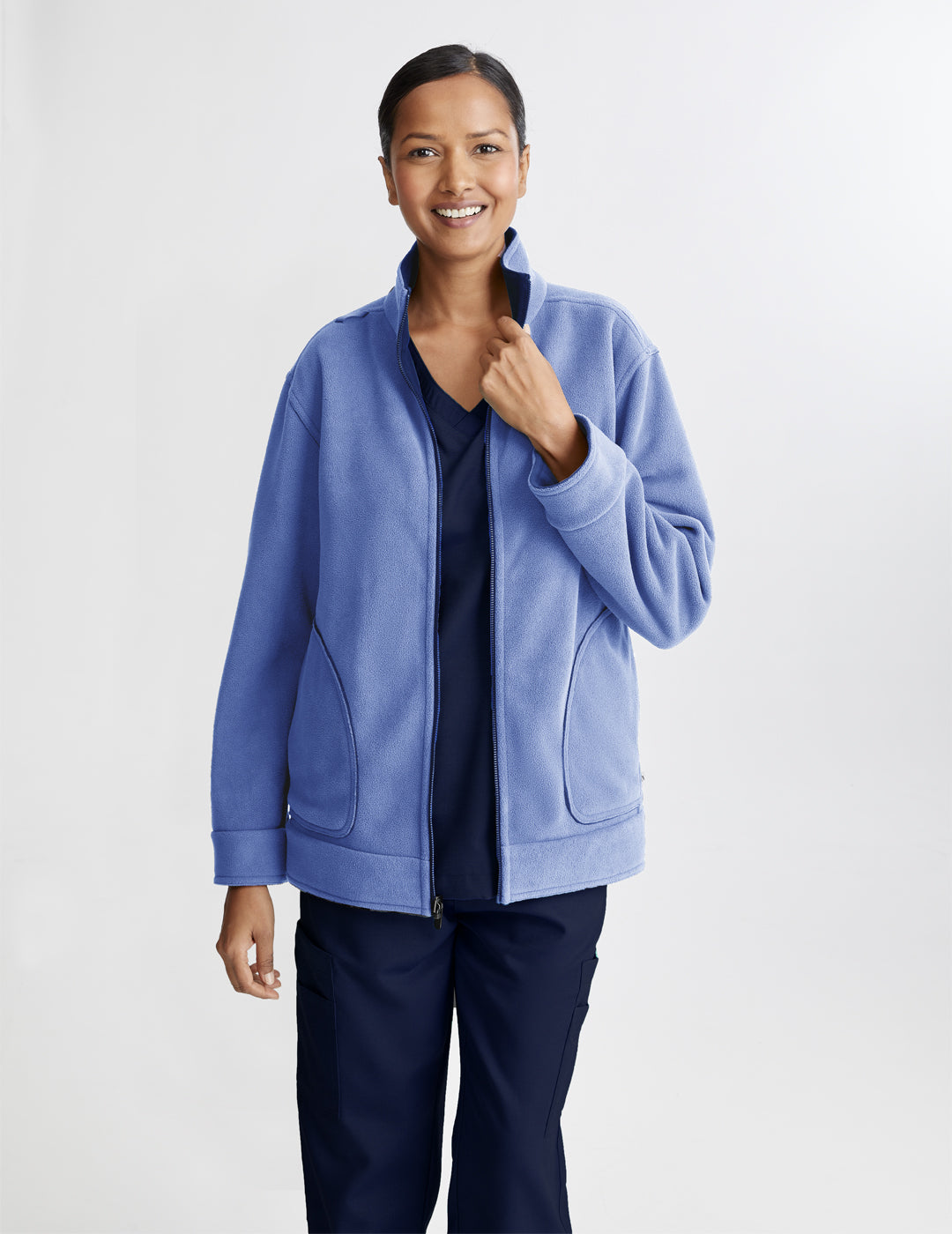 Women's reversible fleece jacket in navy and ceil, offering versatility and warmth