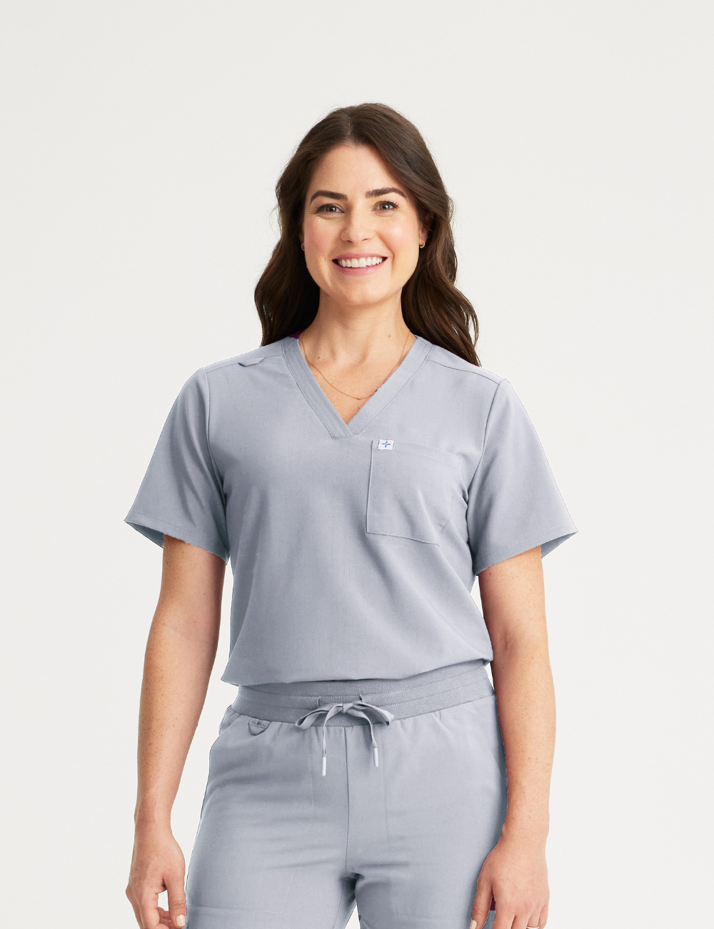 Stone gray women's V-neck scrub top with two pockets, combining practicality and a modern look