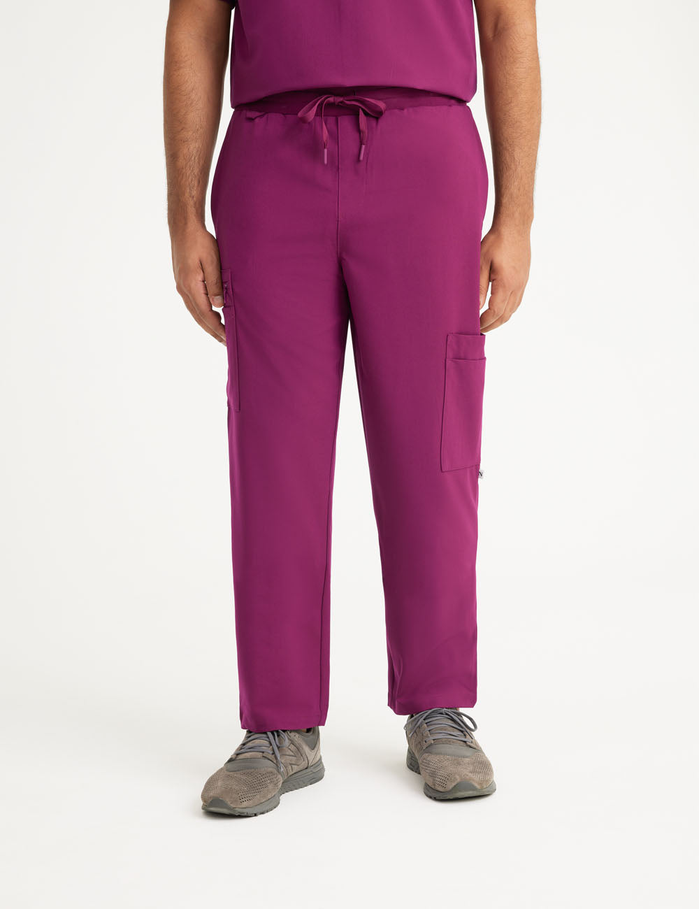 Burgundy men's scrub pants with seven pockets, offering a professional look and plenty of storage