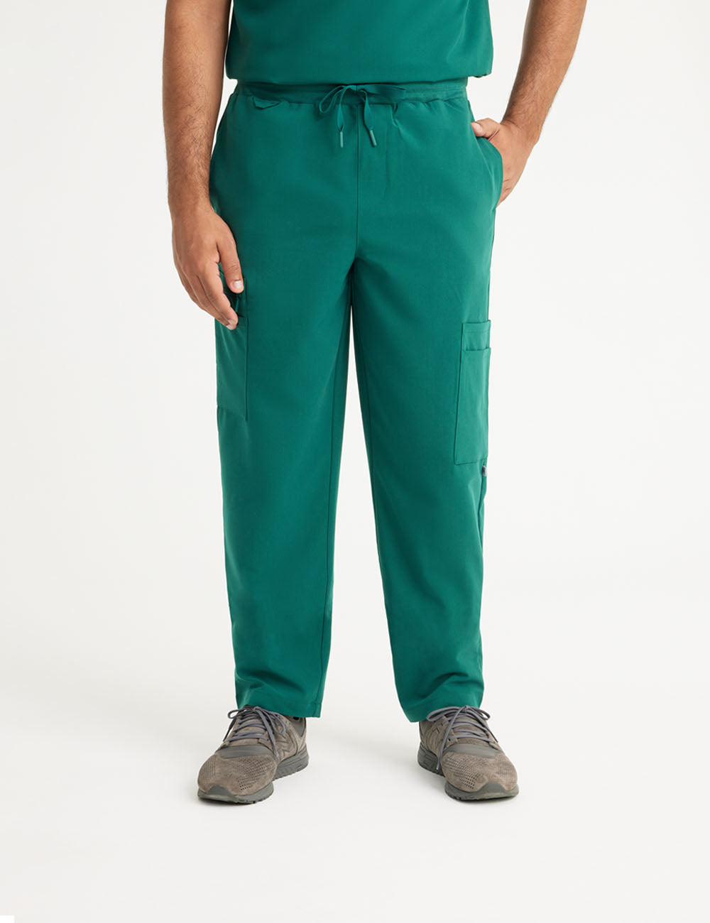 Hunter green men's scrub pants with seven pockets, designed for style and utility