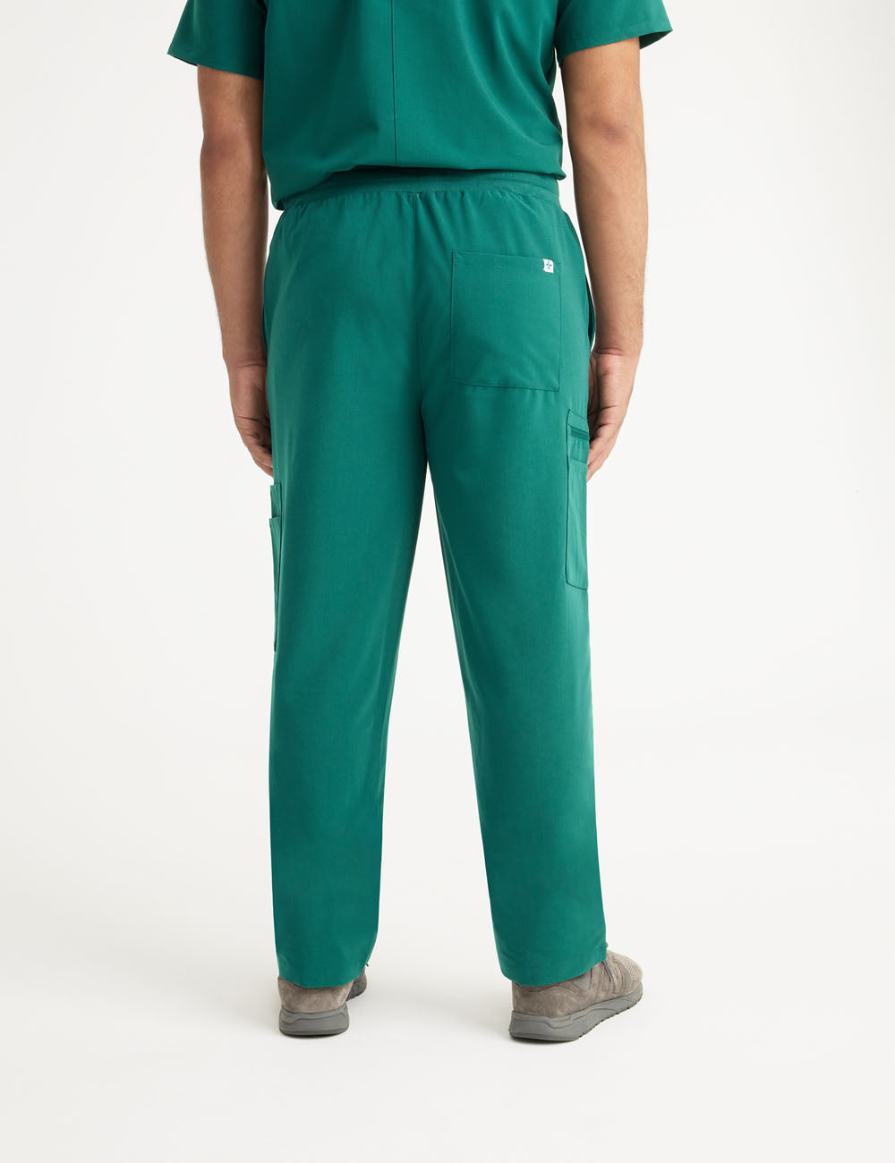 Stylish hunter green men&#39;s scrub pants, featuring a modern fit and ample pockets for convenience