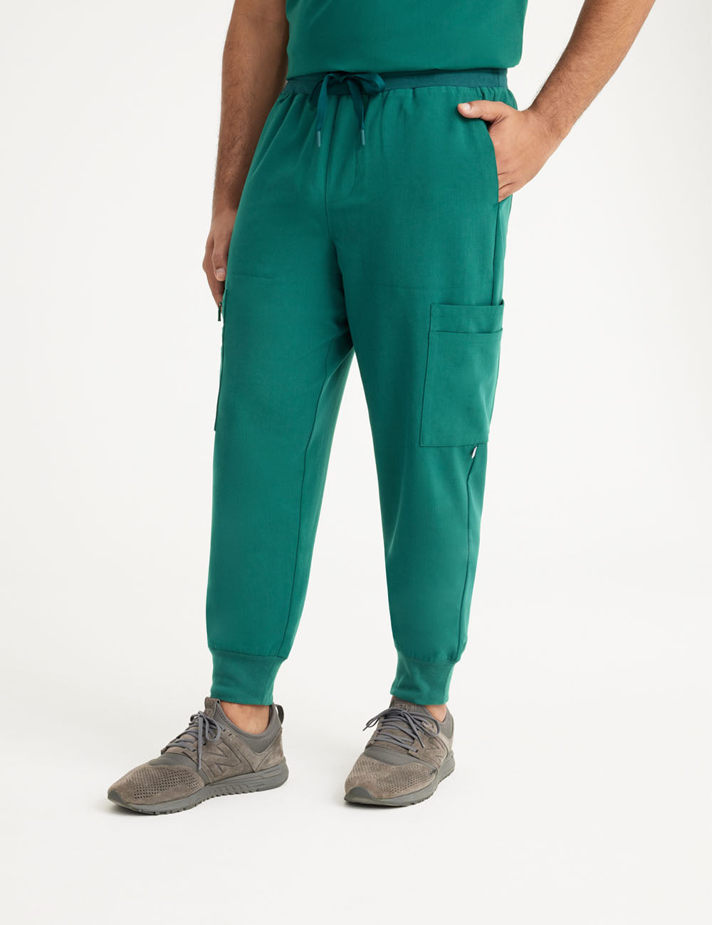 Hunter green men's jogger scrub pants with 10 pockets, designed for comfort and professional use
