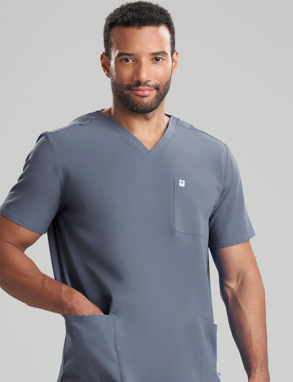 Pewter men's V-neck scrub top with three pockets, combining practicality and a modern look
