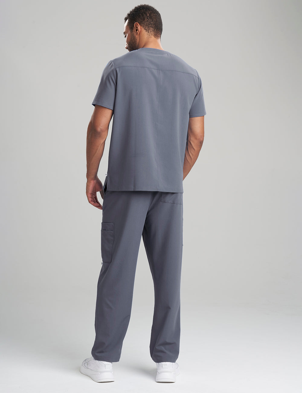 Functional pewter scrub top for men, offering a classic V-neck cut and multiple storage options