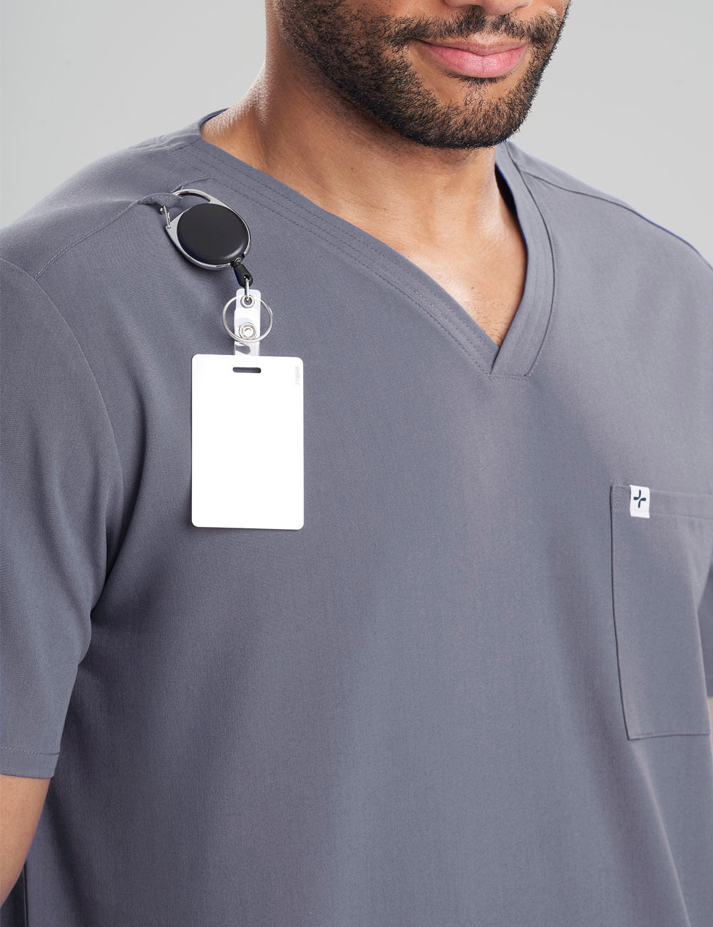 Pewter men's V-neck scrub top with three pockets, combining practicality and a modern look
