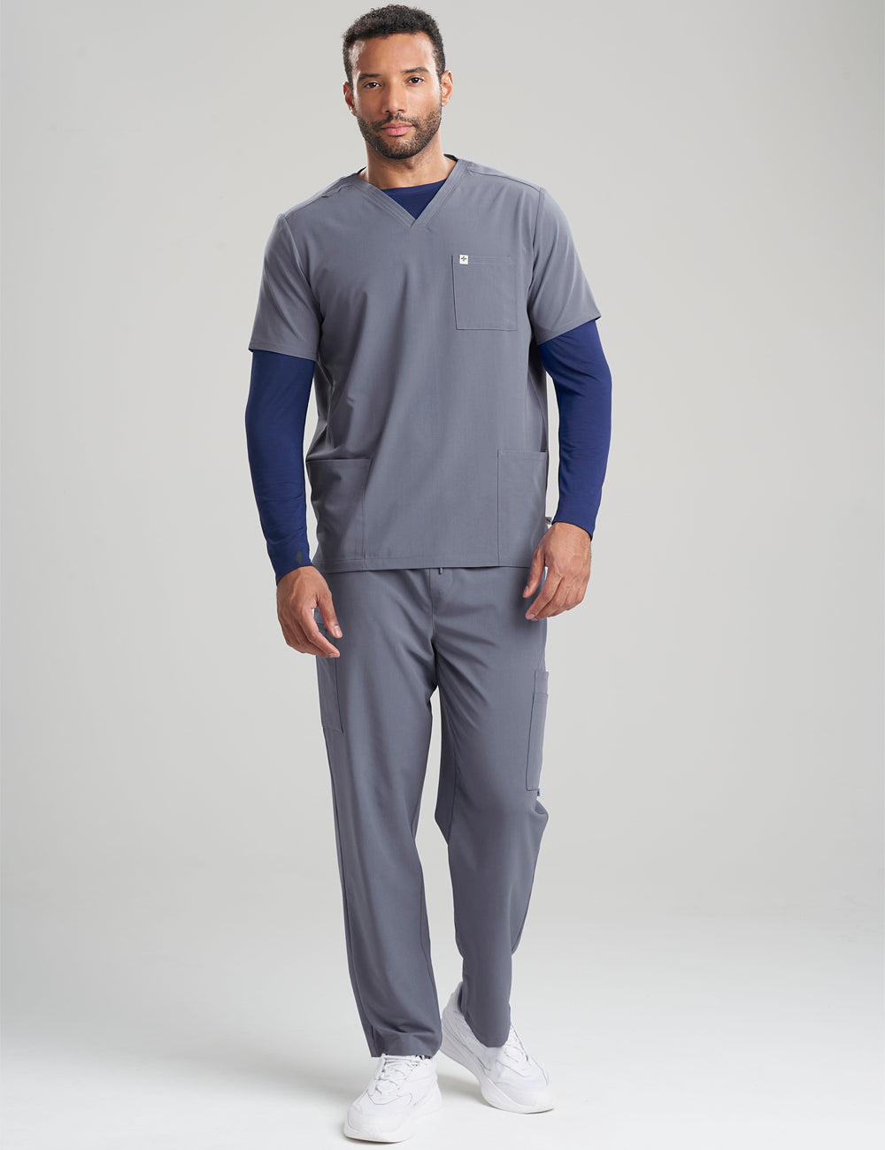 Stylish pewter men&#39;s scrub top, crafted with three pockets for added practicality