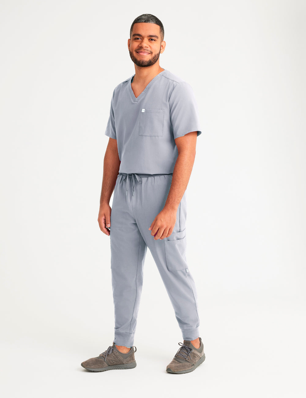 Stone gray men's V-neck scrub top with two pockets, designed for style and utility